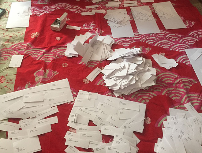 Image showing a pile of paper cards with word parts on them